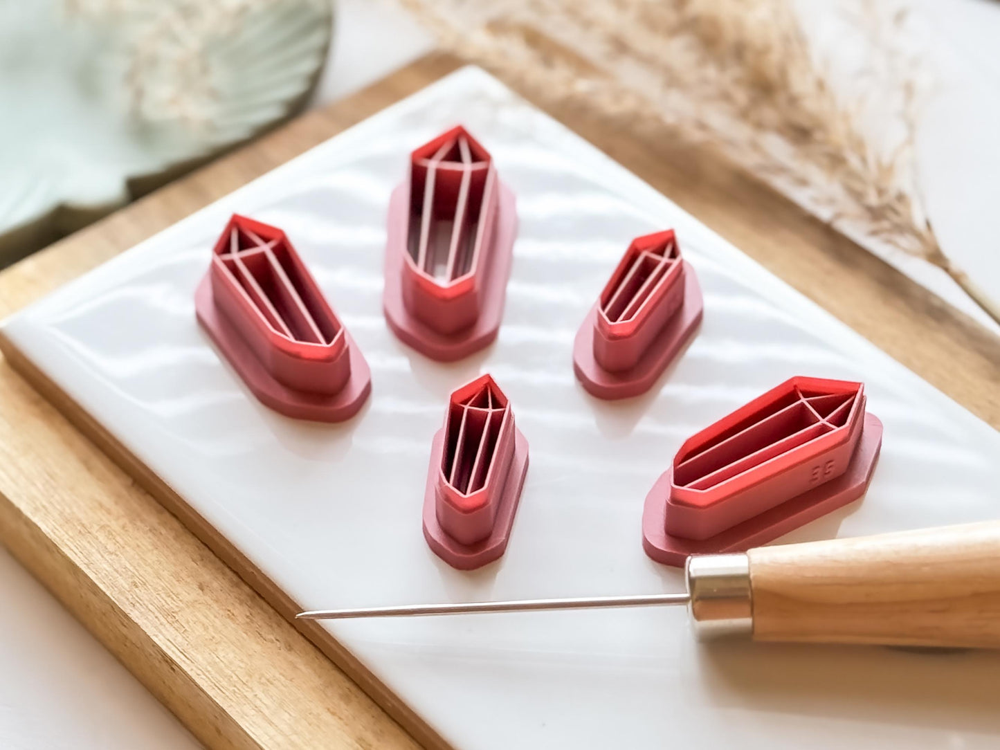 Side view of long sharp point crystal stone polymer clay cutters