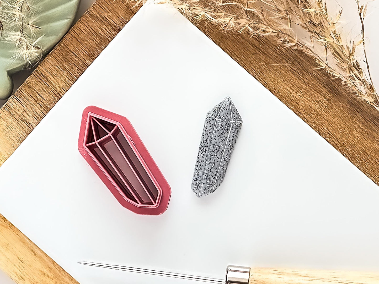 Dark pink crystal clay cutter and stamp with cut out and painted clay piece