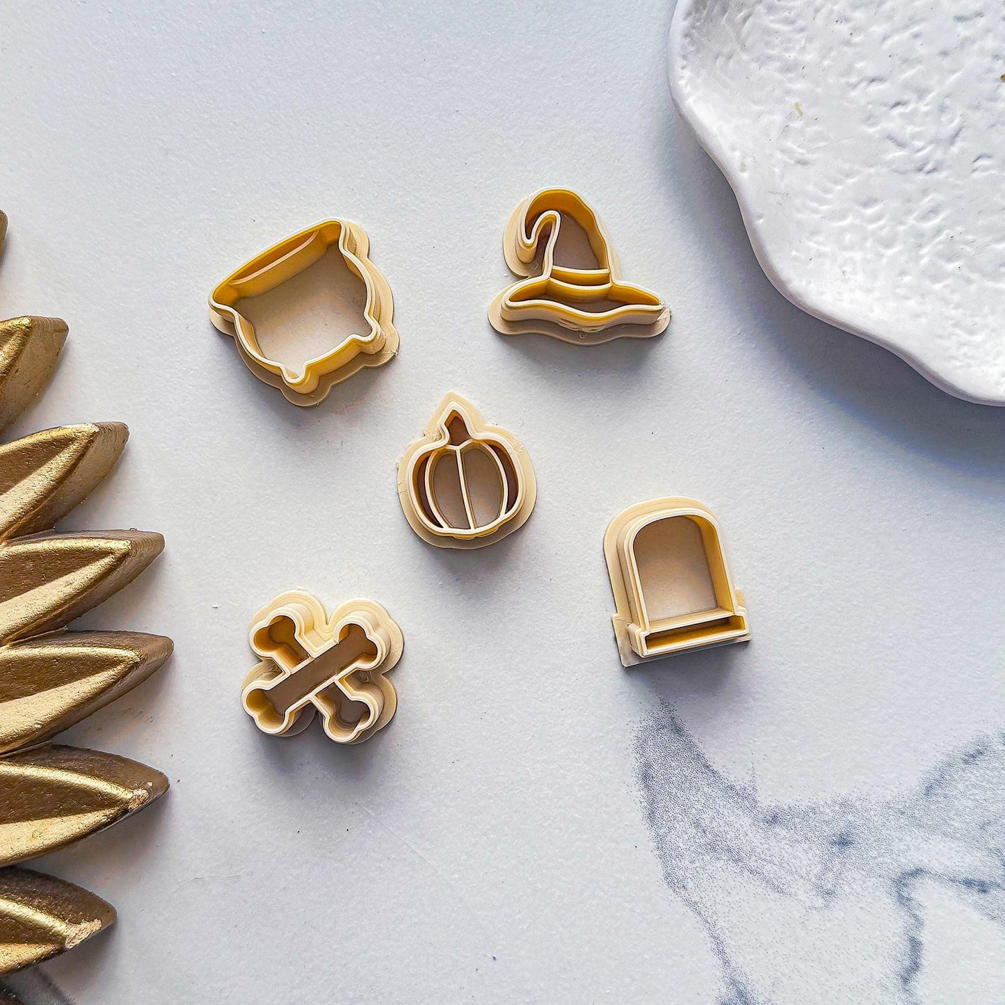 Example of larger size beige 20 mm Halloween clay cutters for stud earrings.