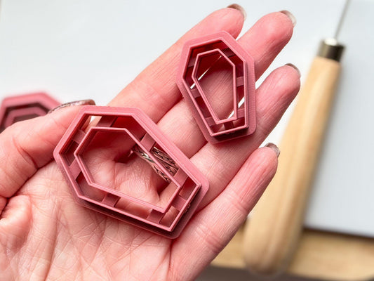 coffin clay cutters in hand