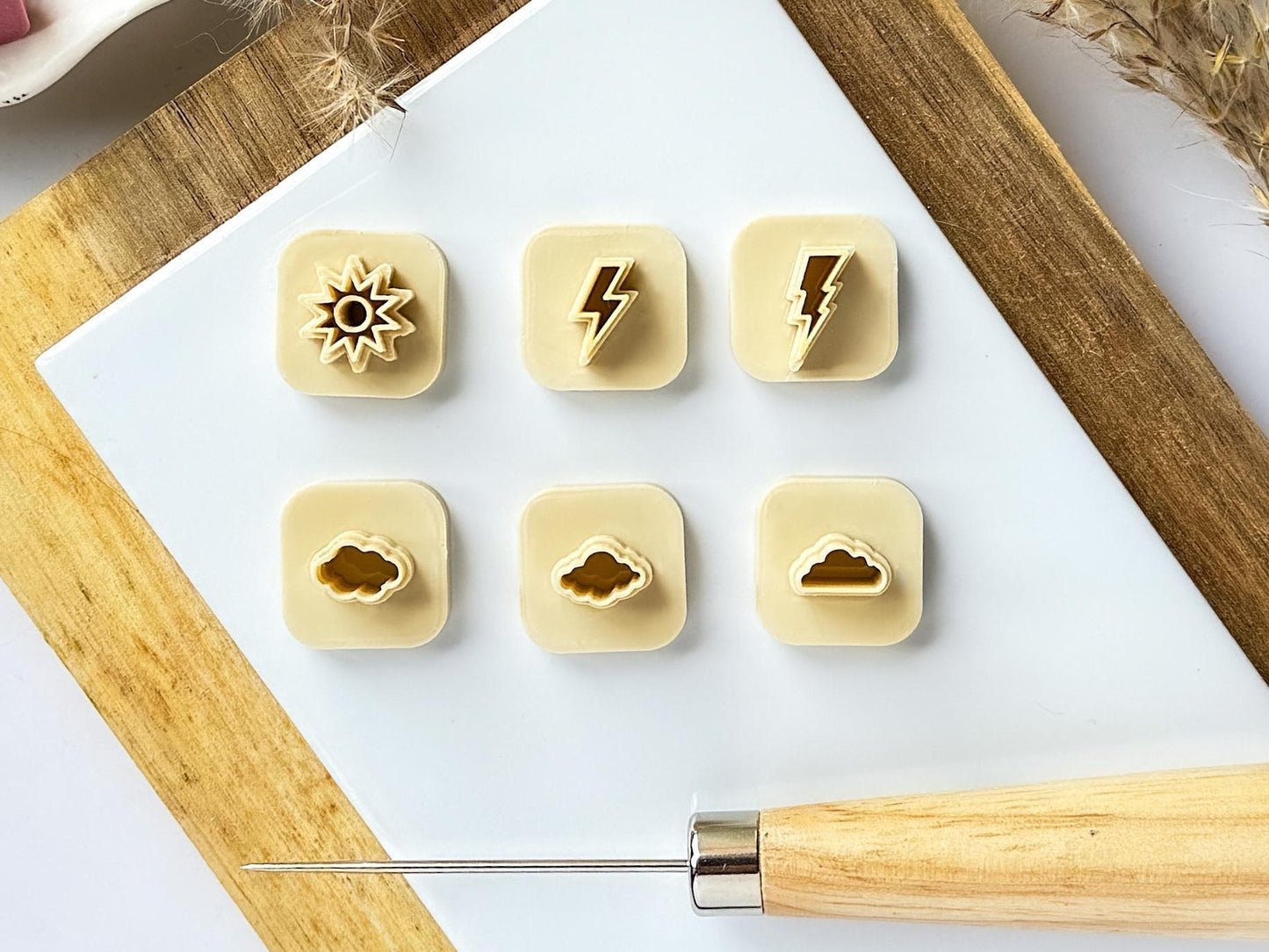 Beige micro clay cutter set on a while tile
