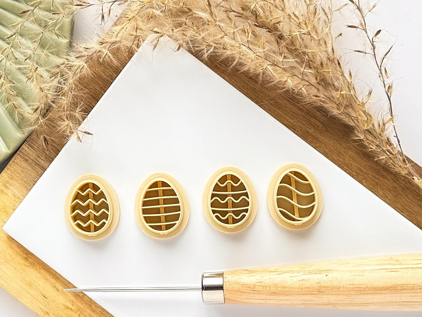 Set of 4 beige easter egg cutters with patterns