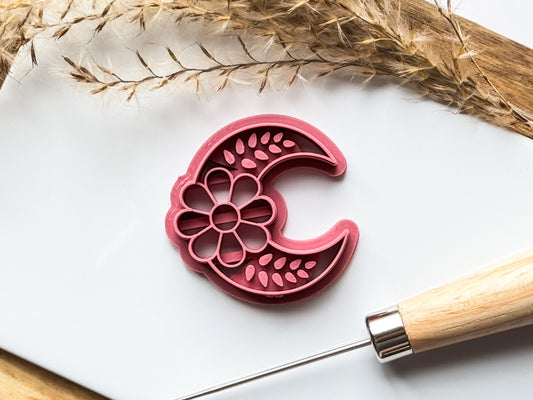 close up of dark pink moon clay cutter
