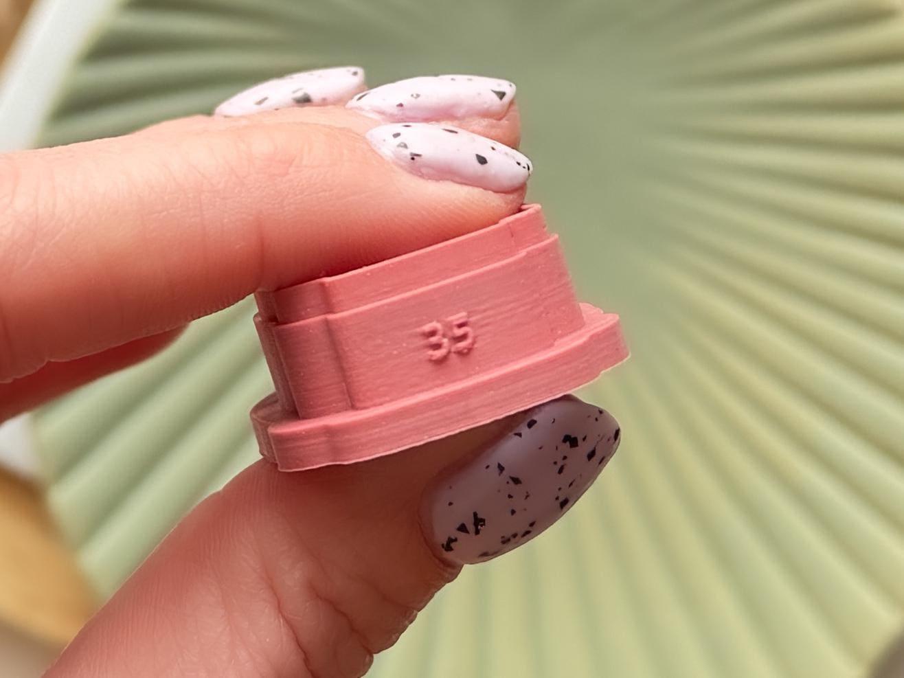 Polymer clay cutter with size printed on the side.