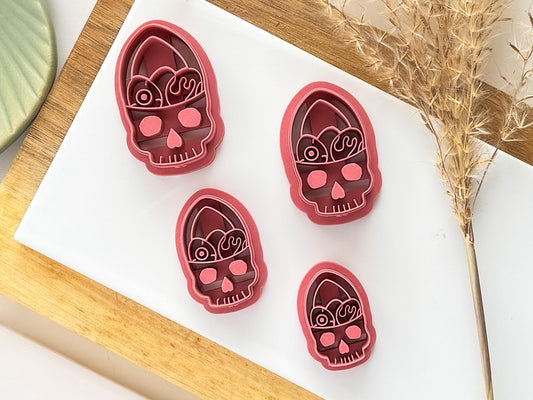 Image showing all size of spooky easter basket polymer clay cutters on a white tile surrounded by decorations