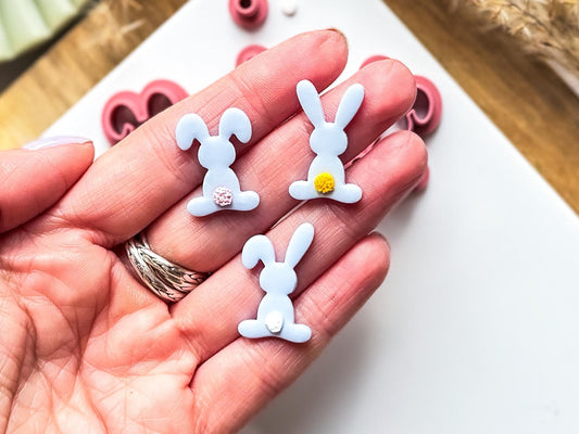 Clay rabbits in hand