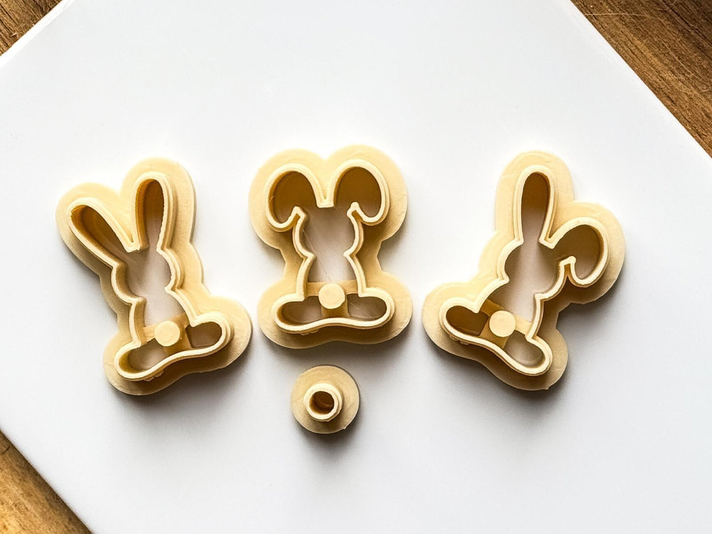 Beige easter bunny cutter on white baking tile