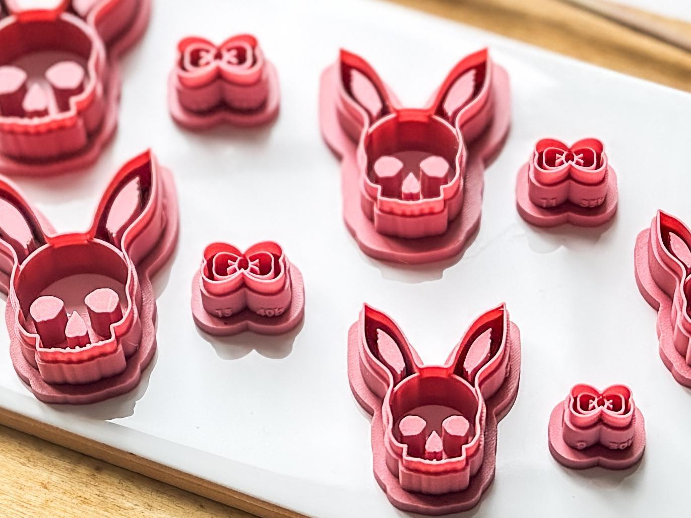 Image showin side view of Easter skull with rabbit ears and cute bow cutter