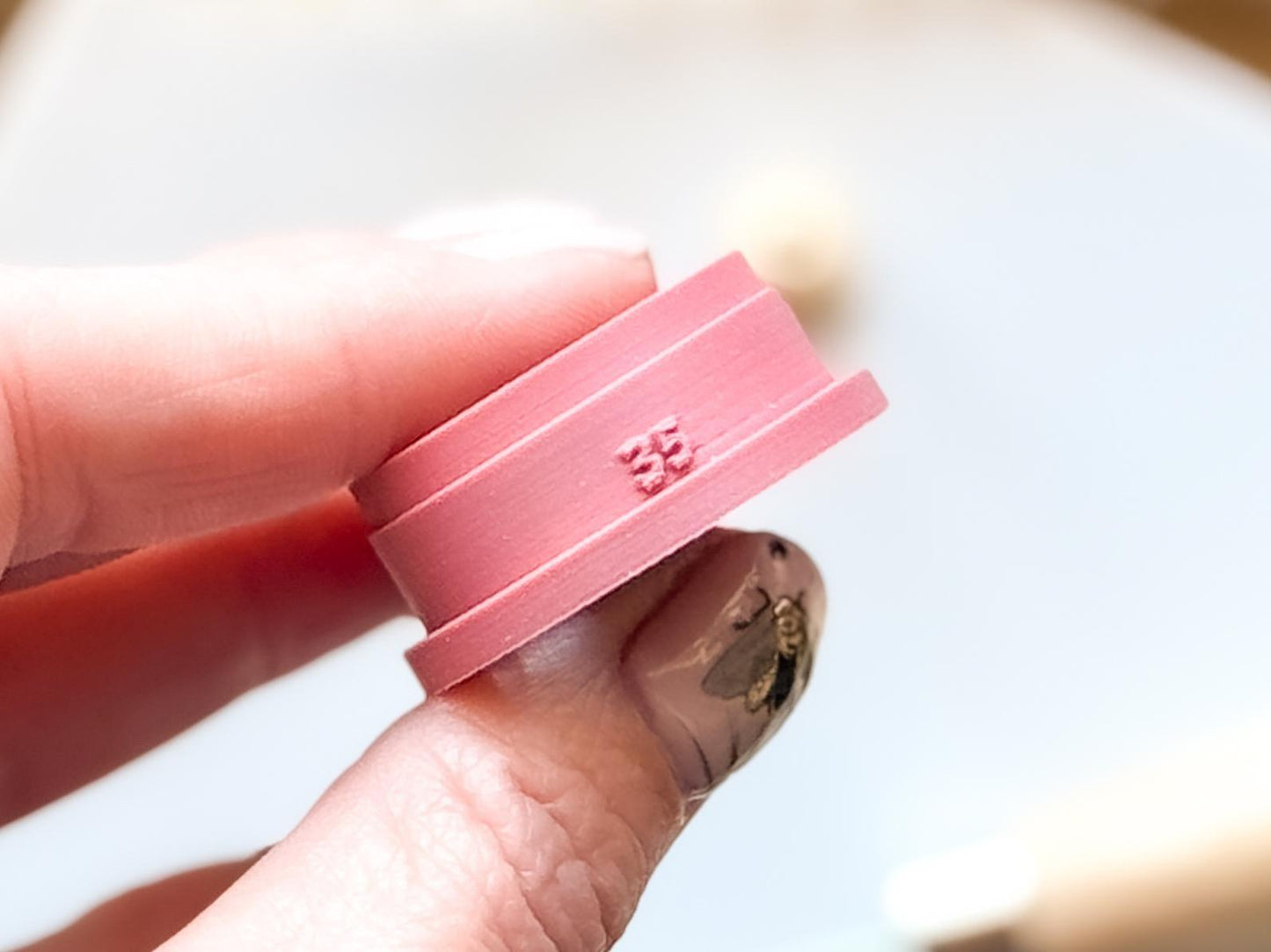 clay cutter with size printed on it