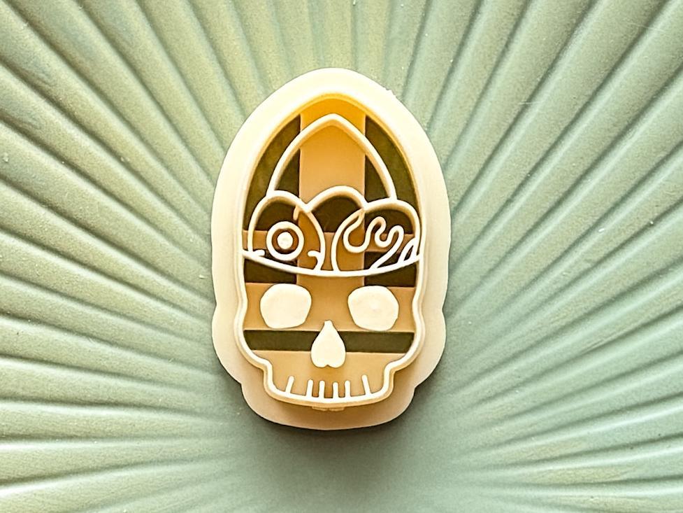 Close up of beige gothic easter cutter on a green plate