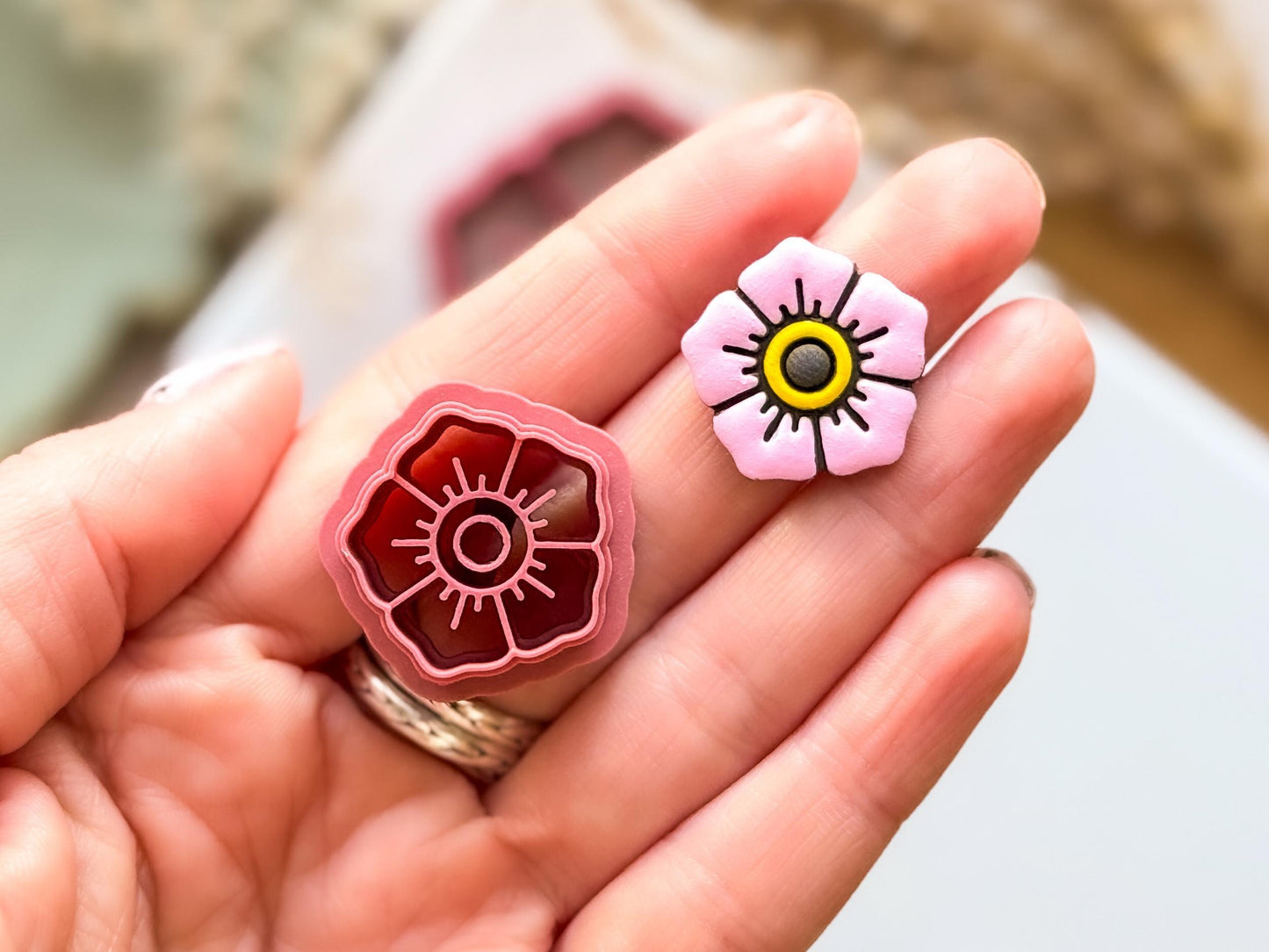 Close up of 20mm trad flower tattoo clay cutterwith sample earring stud made from polymer clay
