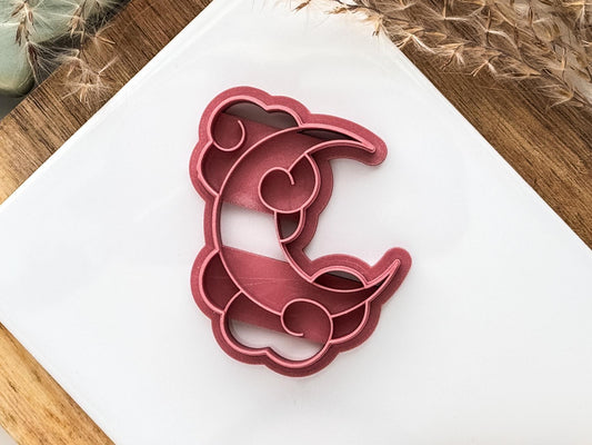 Close up of moon and clouds clay cutter