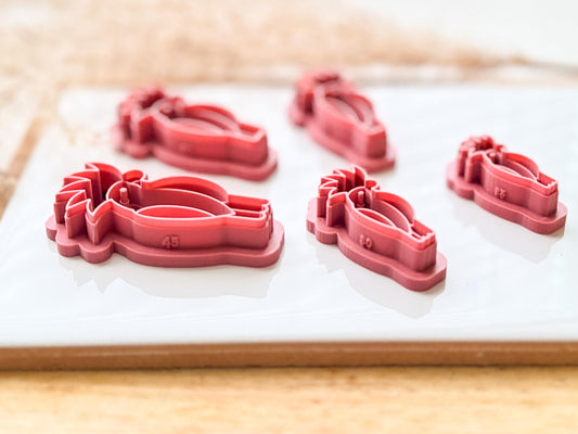 Side view of cackatoo tropical bird clay cutter in all available sizes. This view demonstrates the stamp lin depth and cutting edge thickness