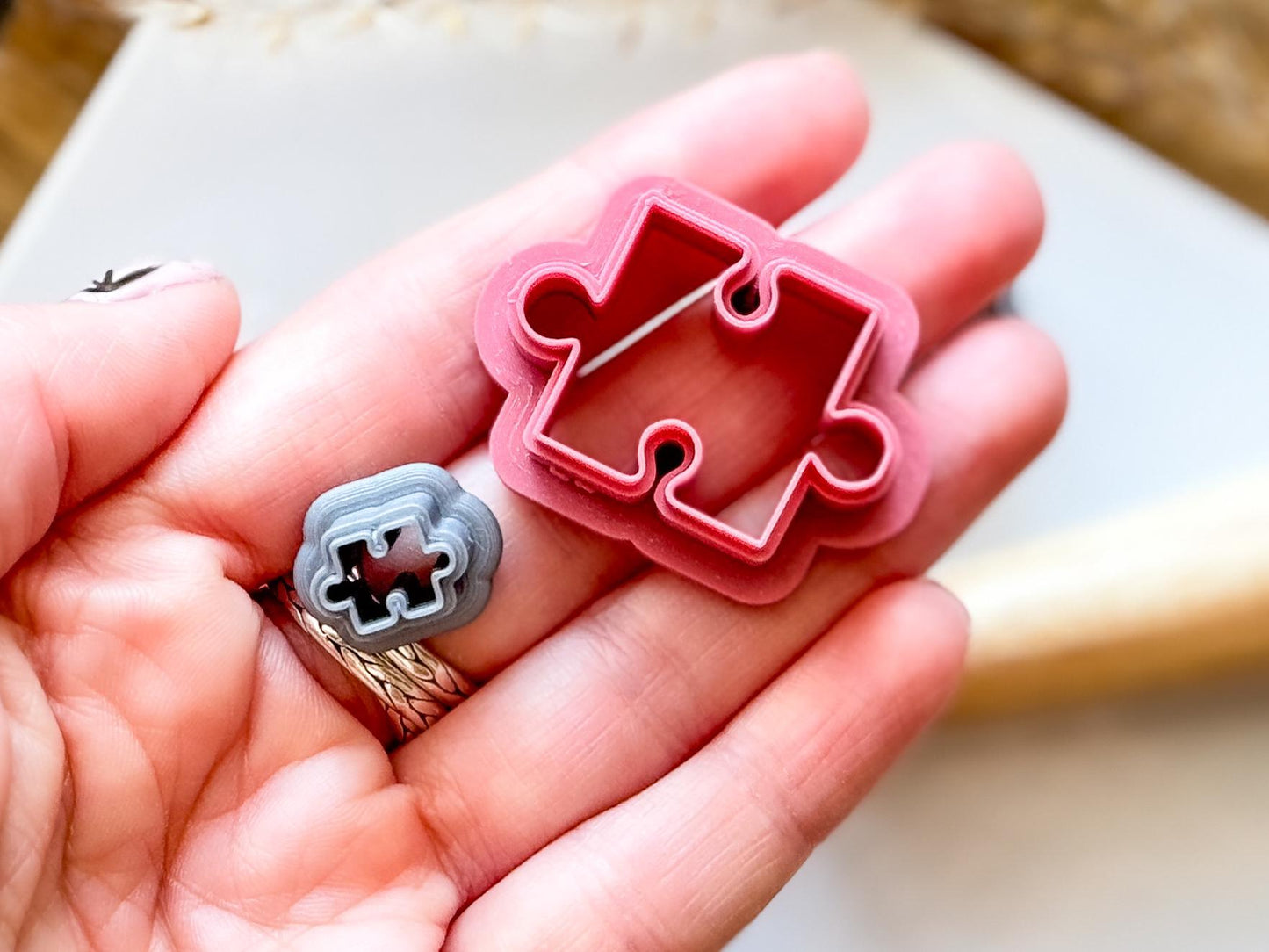 different sizes of jigsaw puzzle piece shaped clay cutters