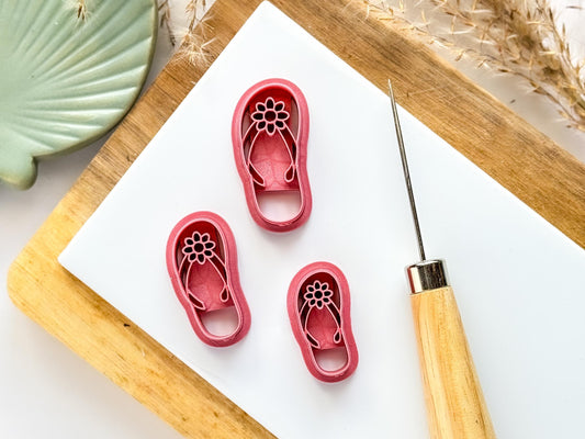 flipflip or foot thong shoe shaped clay cutters in three sizes with straps and flower detail.