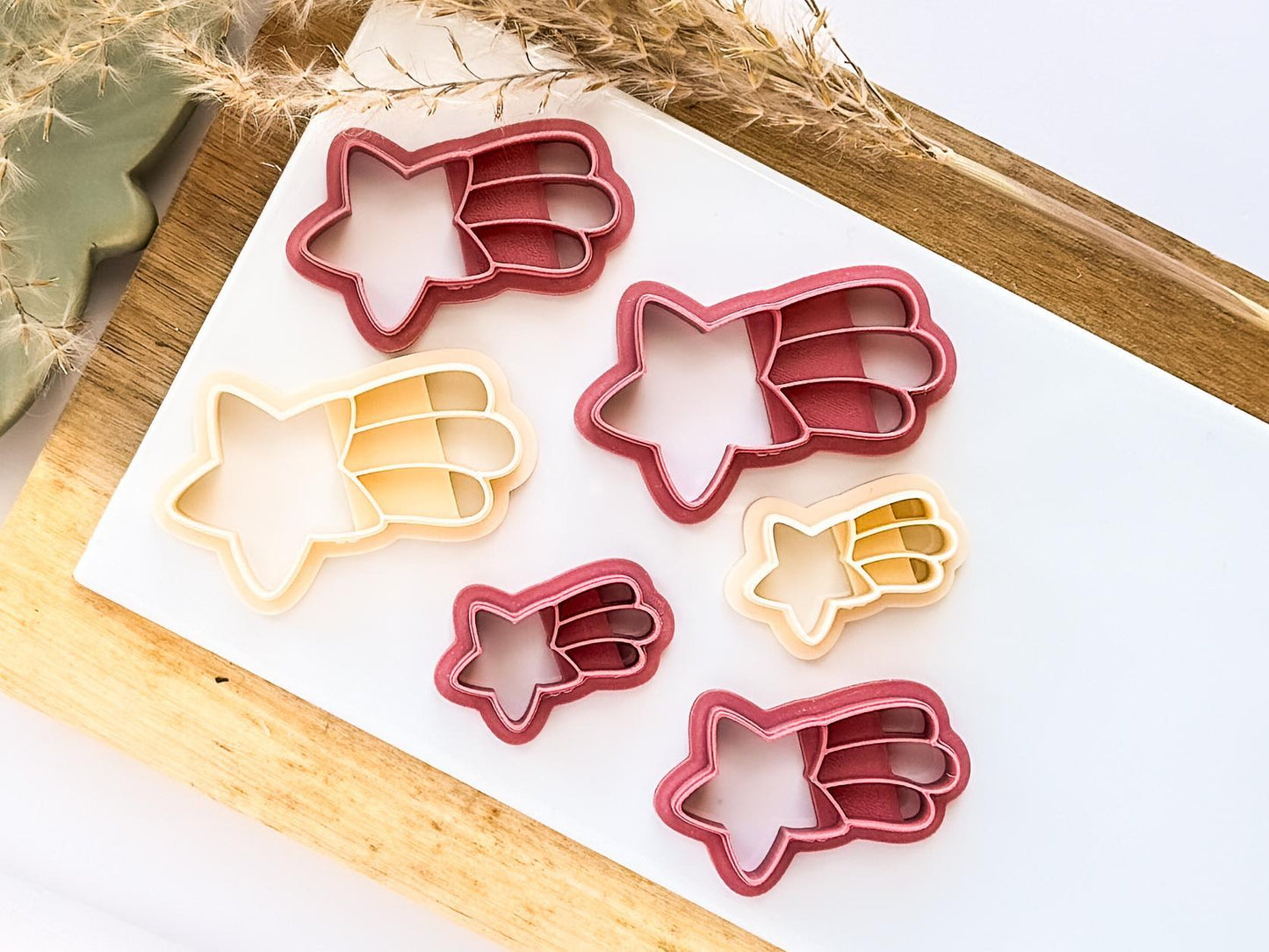 Various sizes of falling star clay cutter in beige and pink