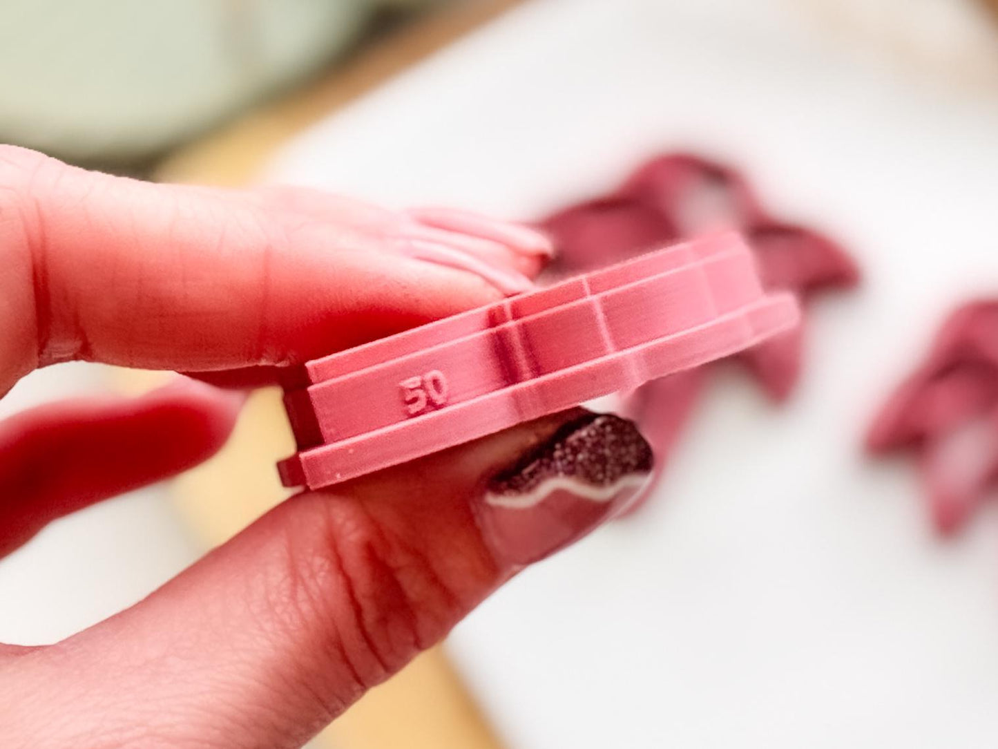 Polymer clay cutter with size printed on the side