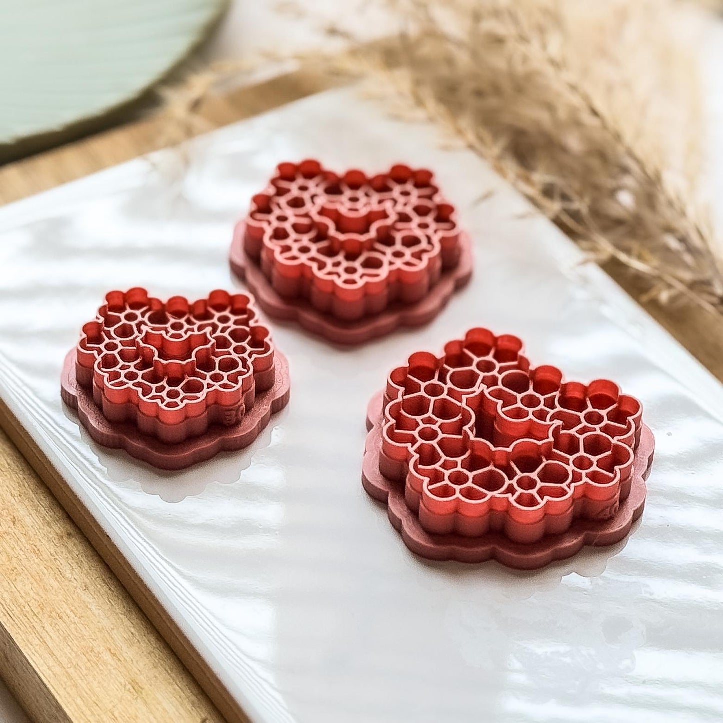 Side view of floral heart shaped clay cutters