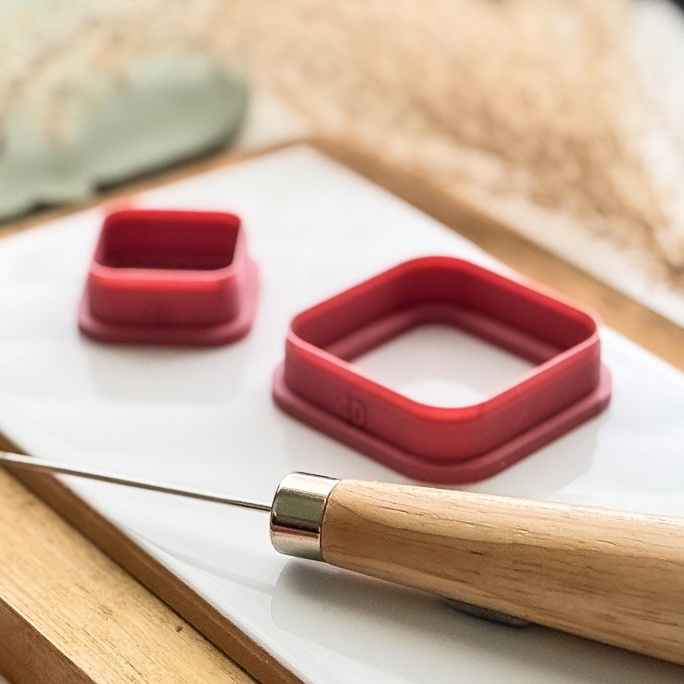 side view of sharp square clay cutters with roudned corners and a bevelled edge