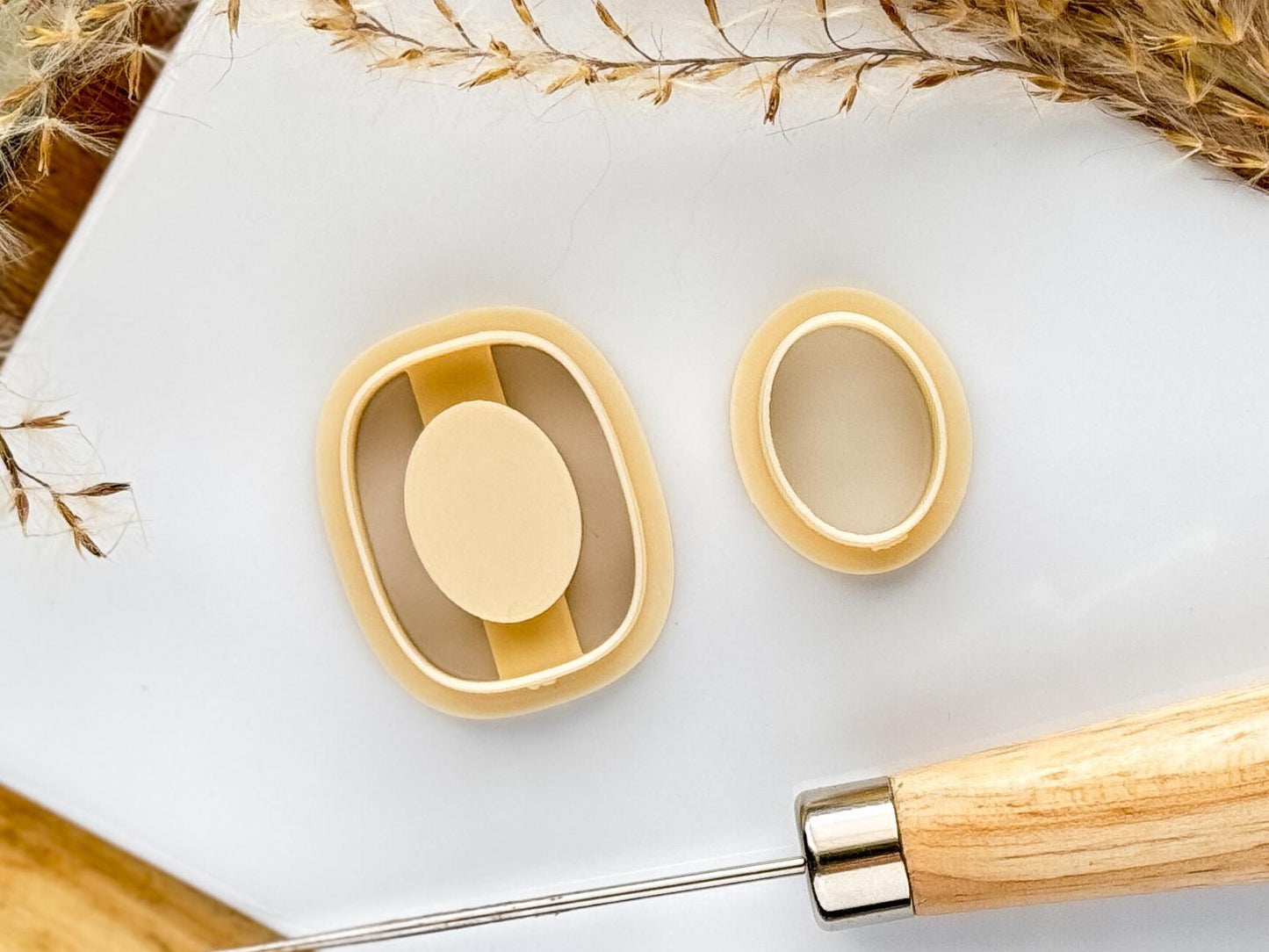 Rounded rectangle clay cutter with debossed inlay center and oval center cutter.