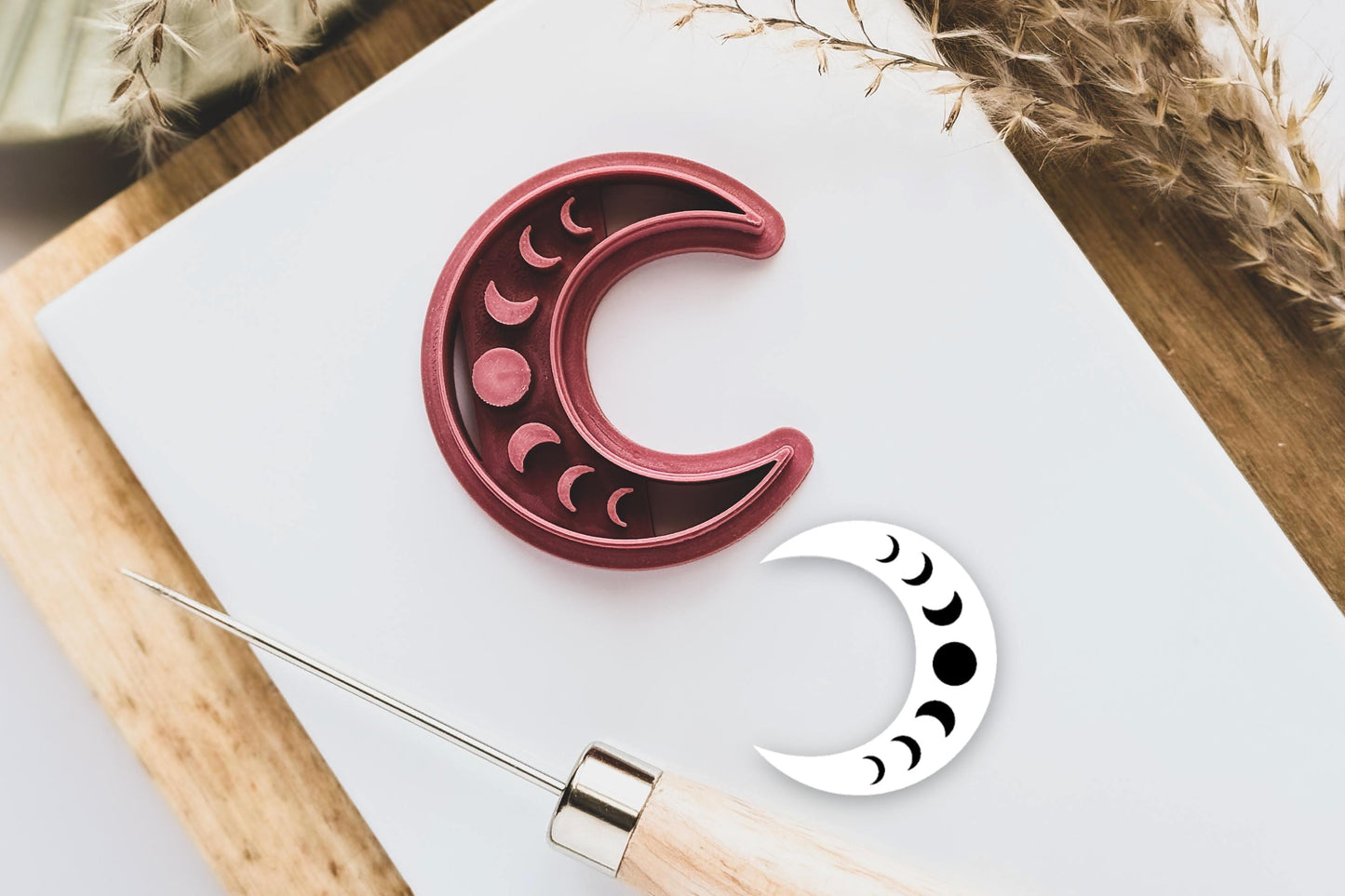 Crescent moon shaped polymer clay cutter with moon phase imprint stamp details
