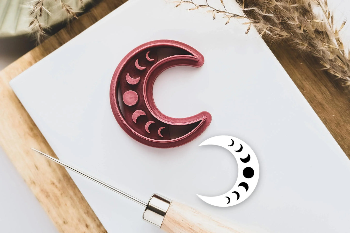 Crescent moon shaped polymer clay cutter with moon phase imprint stamp details