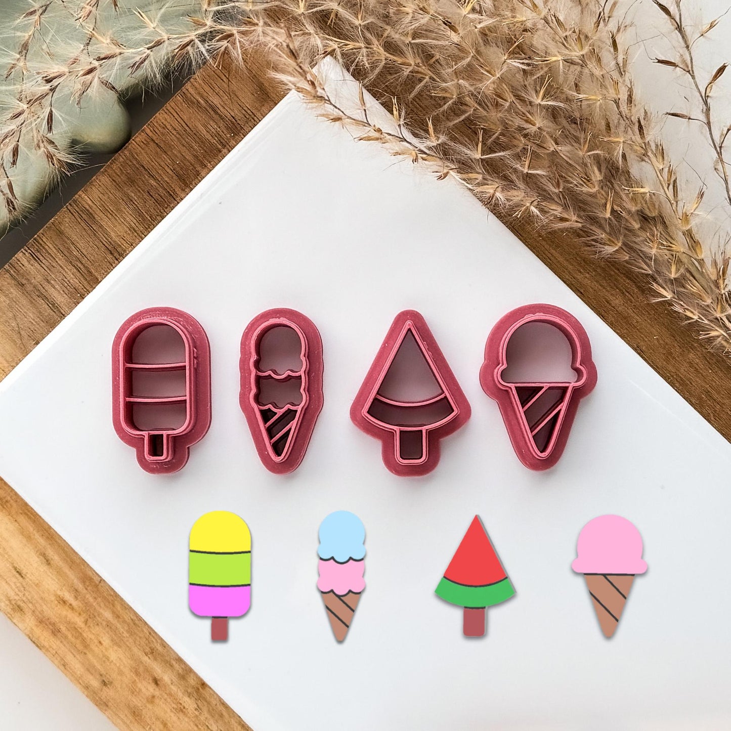 4 shapes of ice cream themed clay cutters. 3 section ice lolly, double ice cream cone in a wafter, watermelon wedge ice lolly, single scoop ice cream cone shapes.