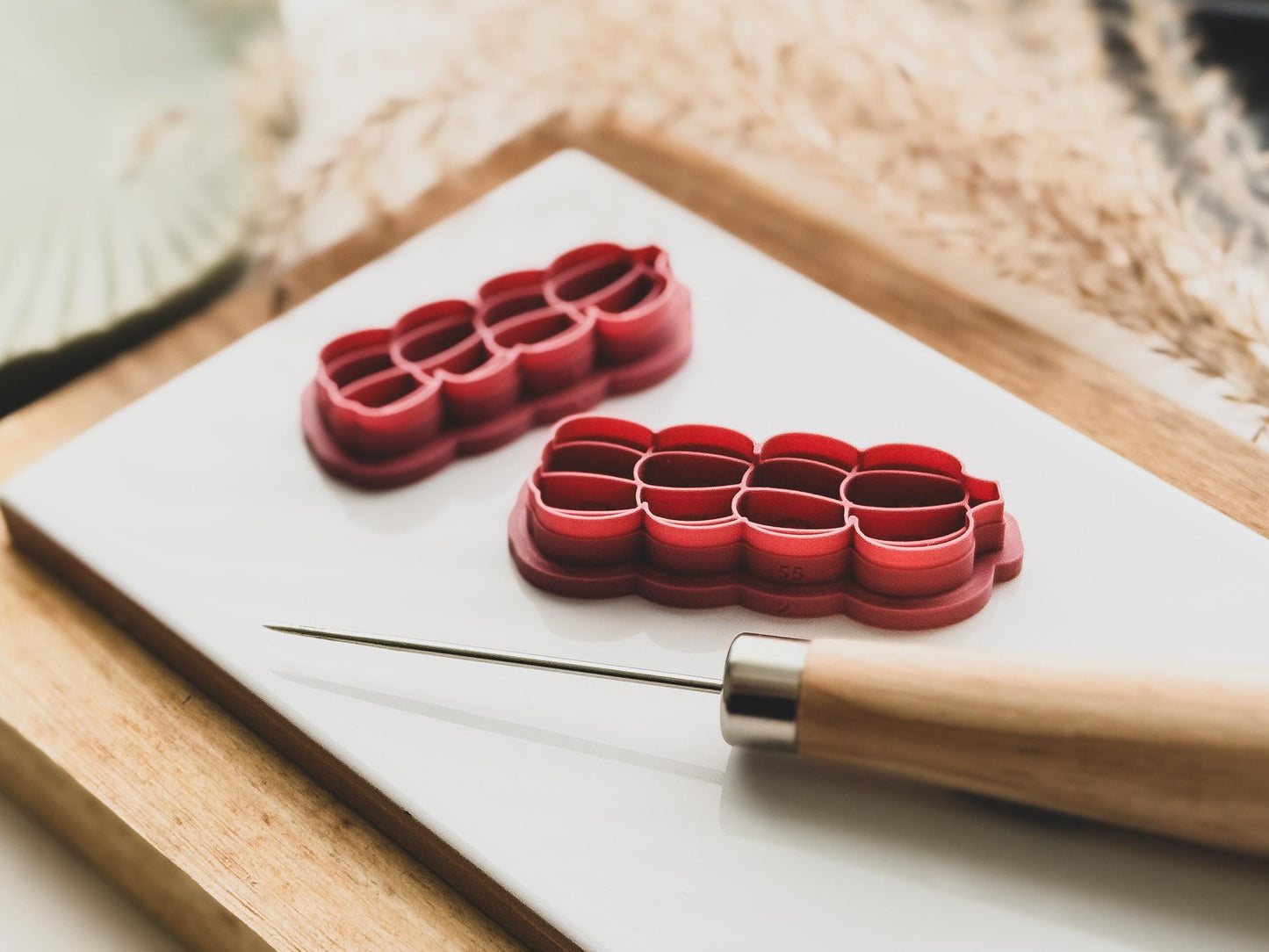 side view of stacked pumpkin clay cutters