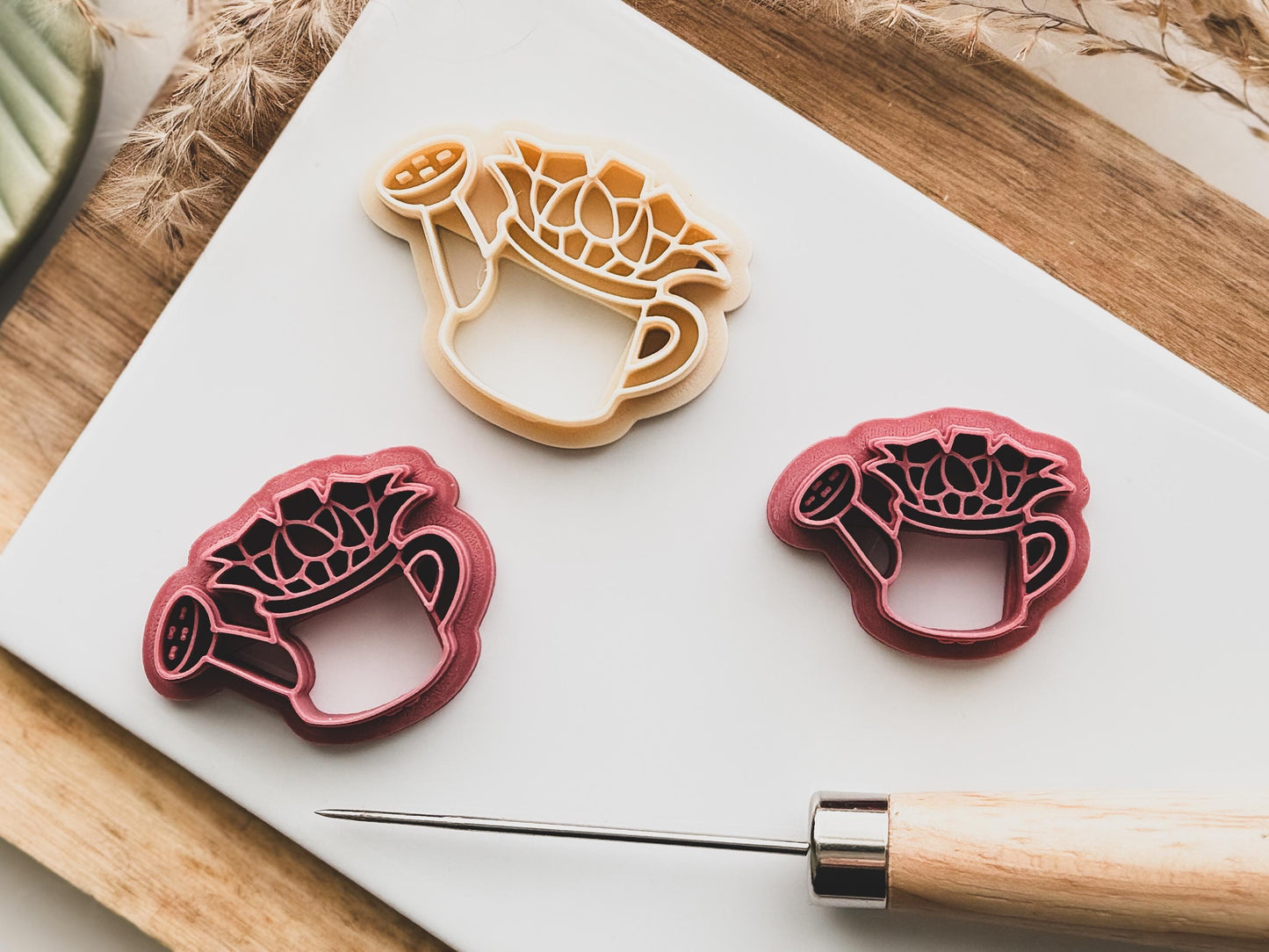 floral wateringcan clay cutter for earring making. Clay cutter in watering can shape with flowers planted