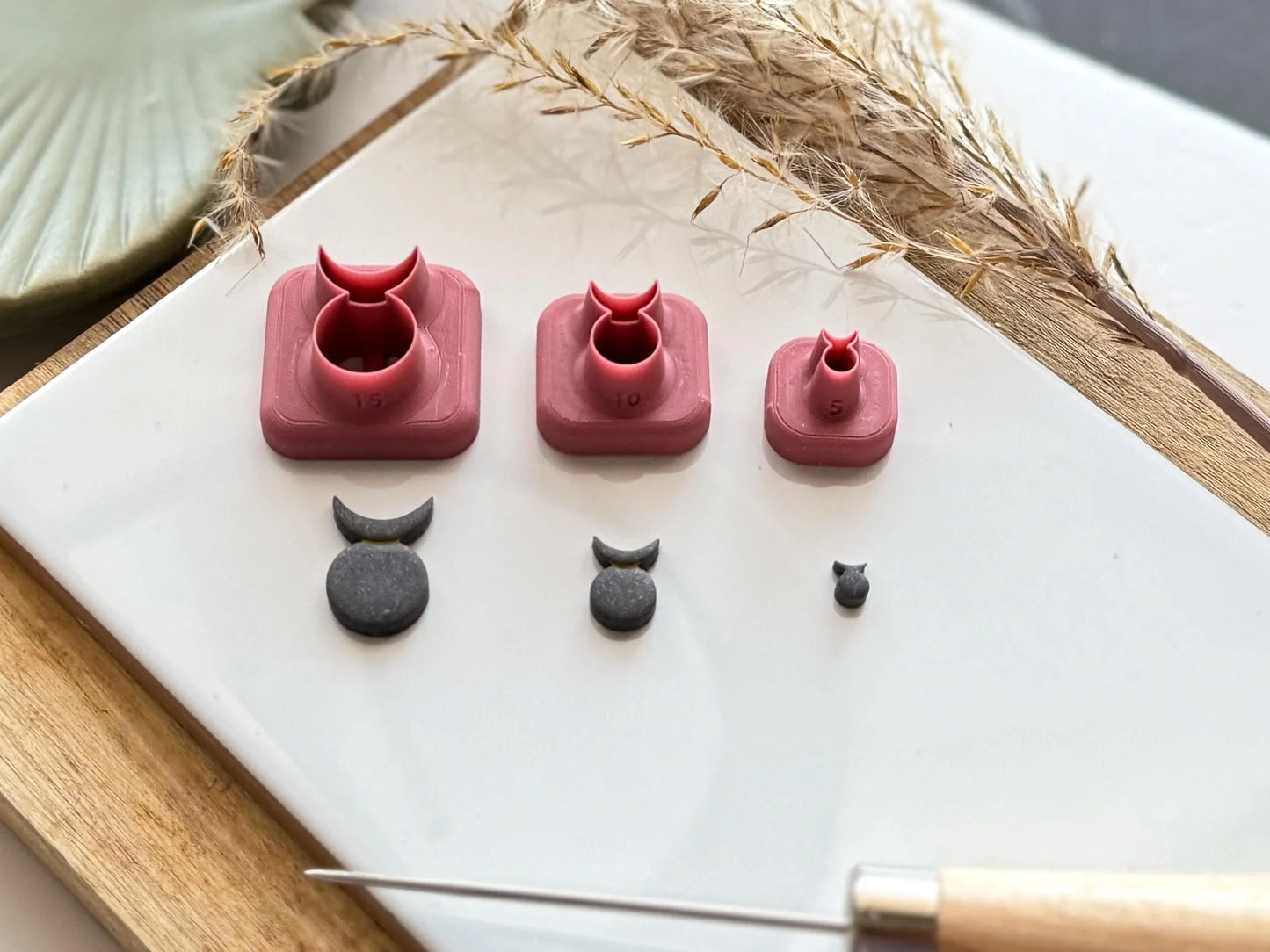 Side view of horned god clay cutters