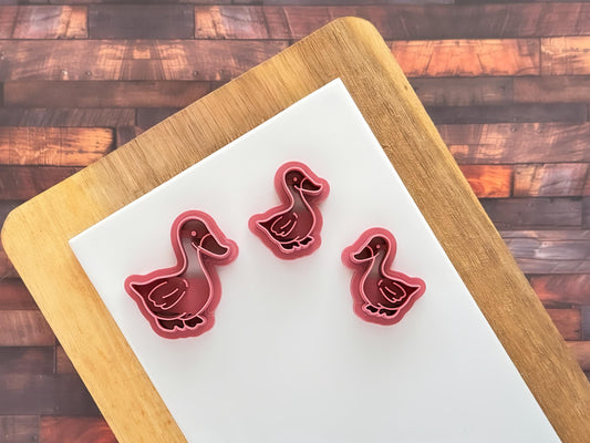duck clay cutter in larger size with small mirrored pair of cutters