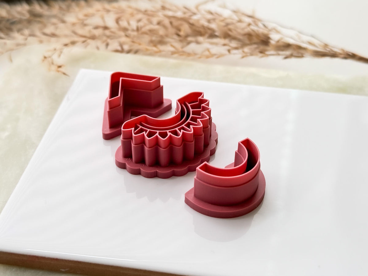 Side view of solace earring cutter set showing chevron, arch and tribal style cutters.
