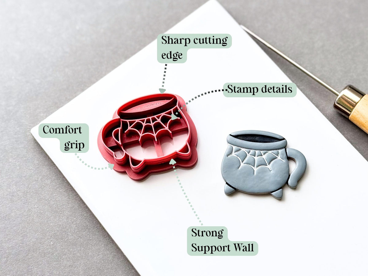 Feature graphic showing a Halloween cauldron clay cutter with a spiderweb design, alongside a finished grey polymer clay cauldron. Labels highlight the sharp cutting edge, stamp details, strong support wall and comfortable grip.