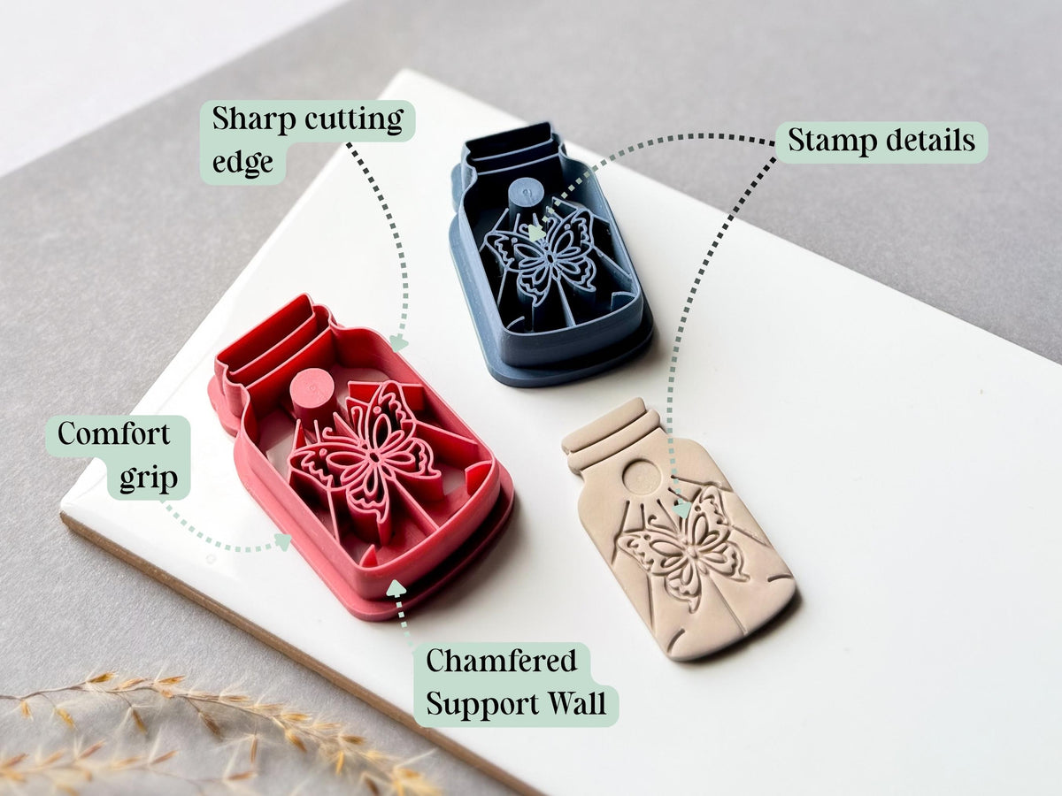 Feature graphic showing butterfly specimen jar clay cutters in red and blue beside a finished cream polymer clay cut-out. Labels highlight the sharp cutting edge, detailed stamp design, comfortable grip and chamfered support wall.