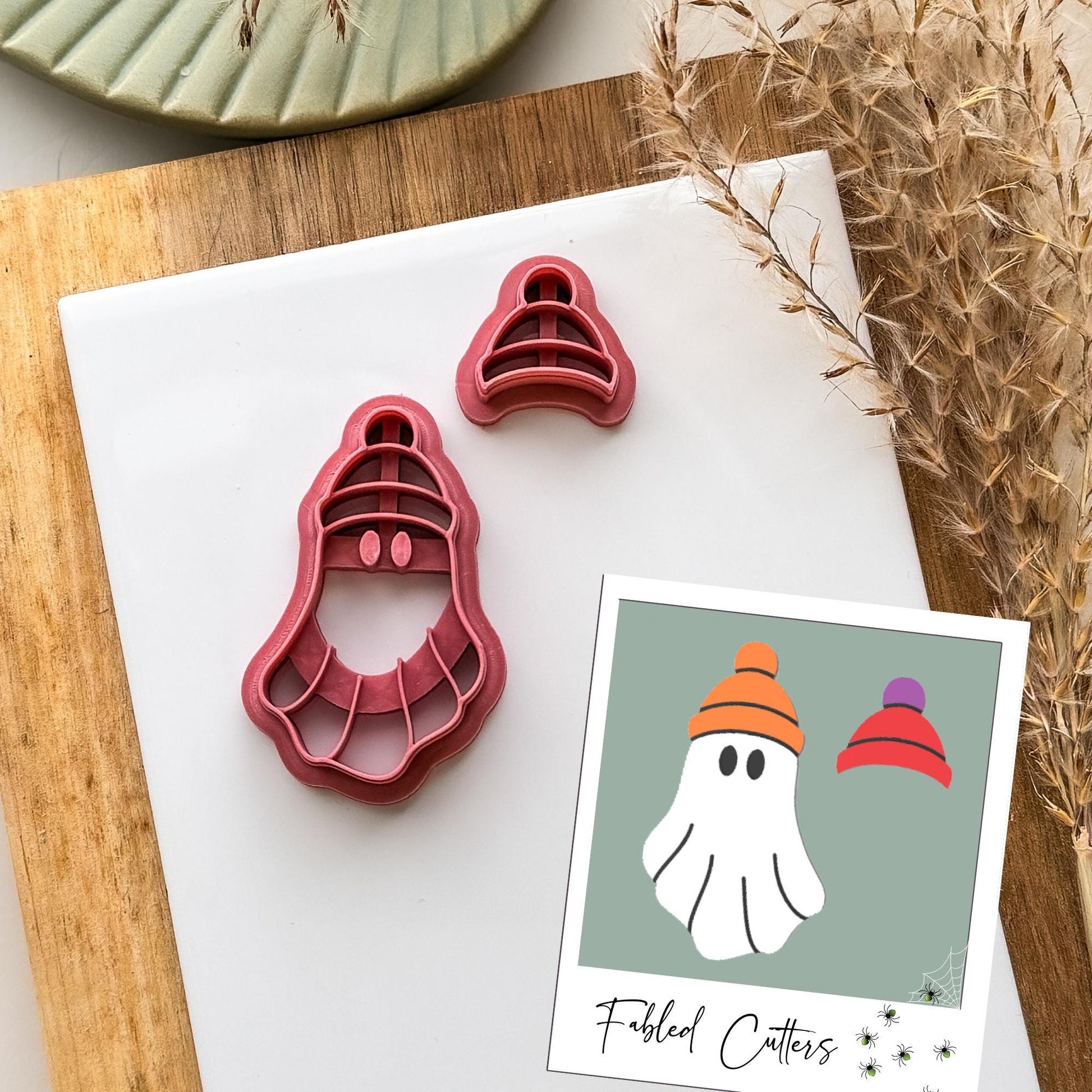 Polymer clay cutter in ghost shape with a bobble hat and separate hat cutter for changing textures and colours.