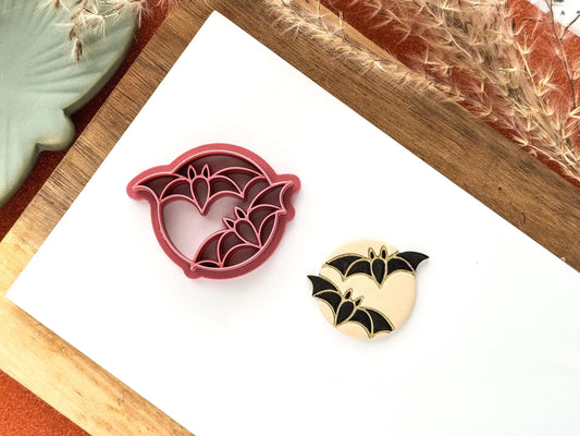 Clay cutter with flying bats and moon detail. Circular shape with bat stamp details.
