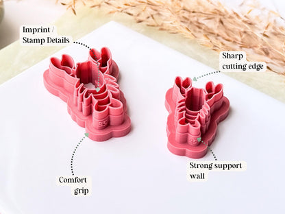 Two pink clay cutters on a white surface with text highlighting features.