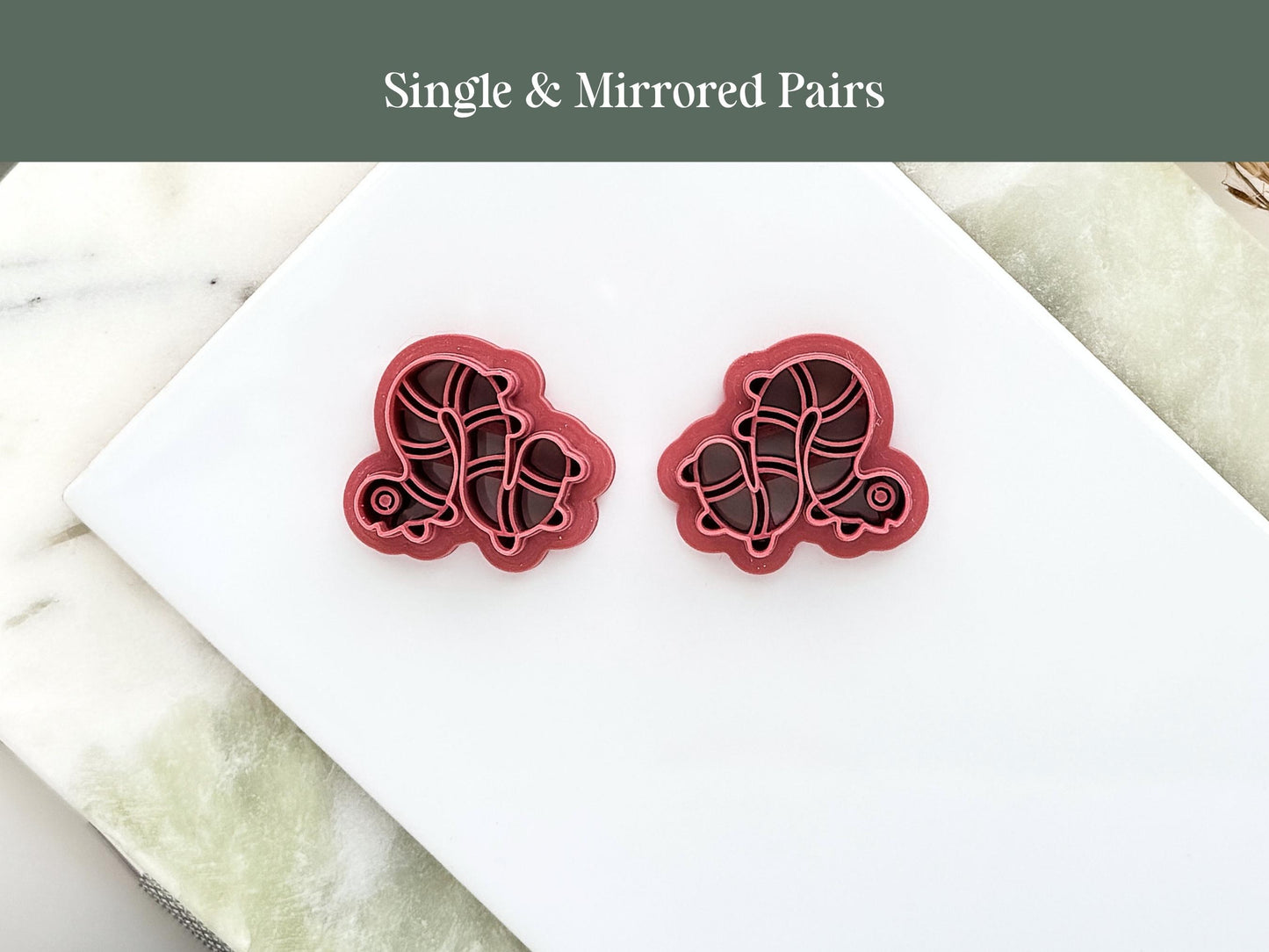 two caterpillar shaped clay cutters in a mirrored pair for earring making