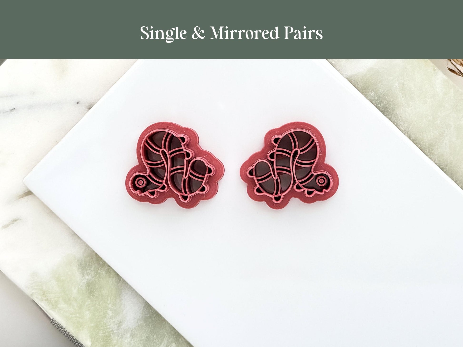 two caterpillar shaped clay cutters in a mirrored pair for earring making
