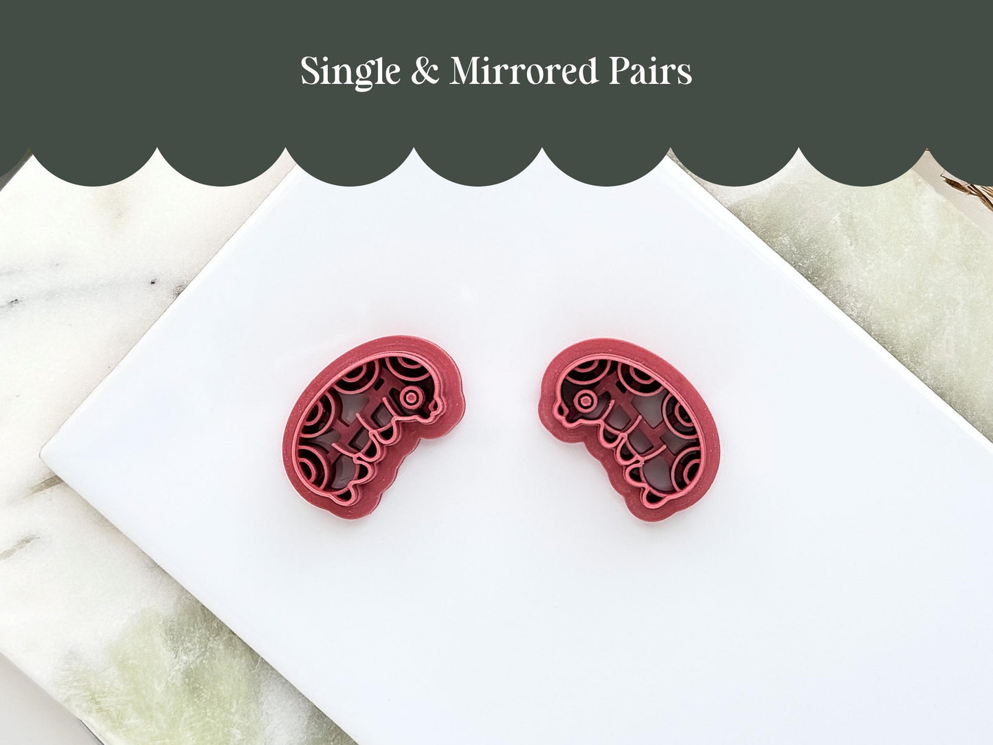 Mirrored pair of insect grub clay cutters for making polymer clay earrings