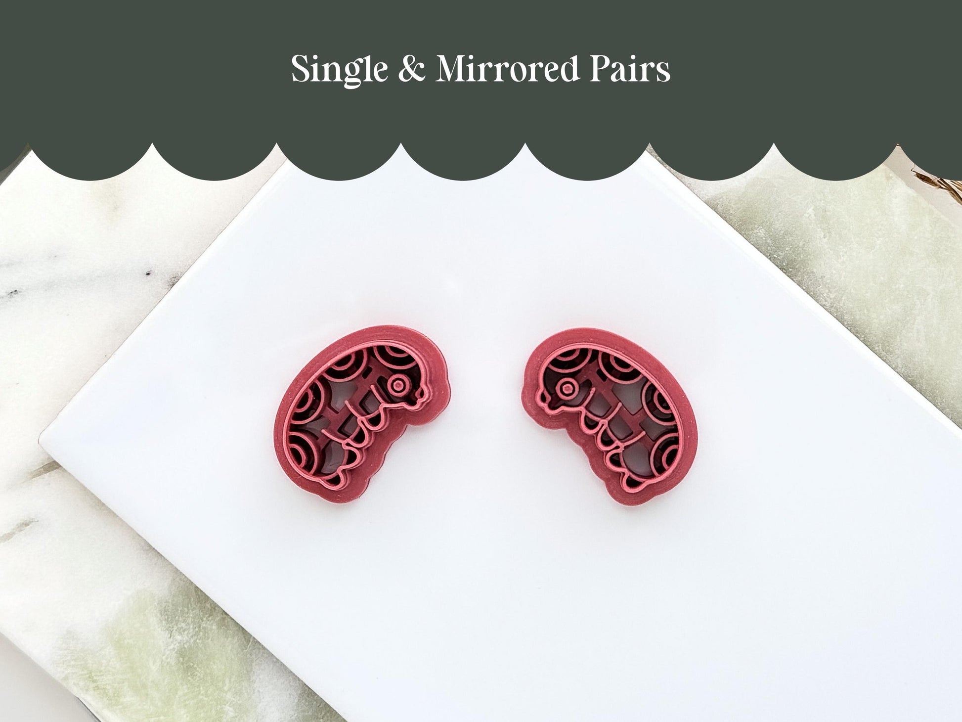 Mirrored pair of insect grub clay cutters for making polymer clay earrings