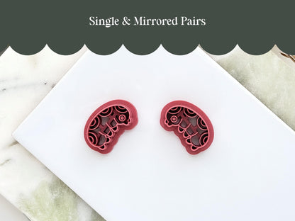 Mirrored pair of insect grub clay cutters for making polymer clay earrings