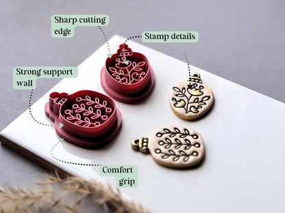 Feature graphic highlighting the botanical Christmas bauble polymer clay cutters' detailed floral and leafy stamp designs, sharp cutting edges, strong support walls and comfortable grip, shown beside matching finished clay embellishments.