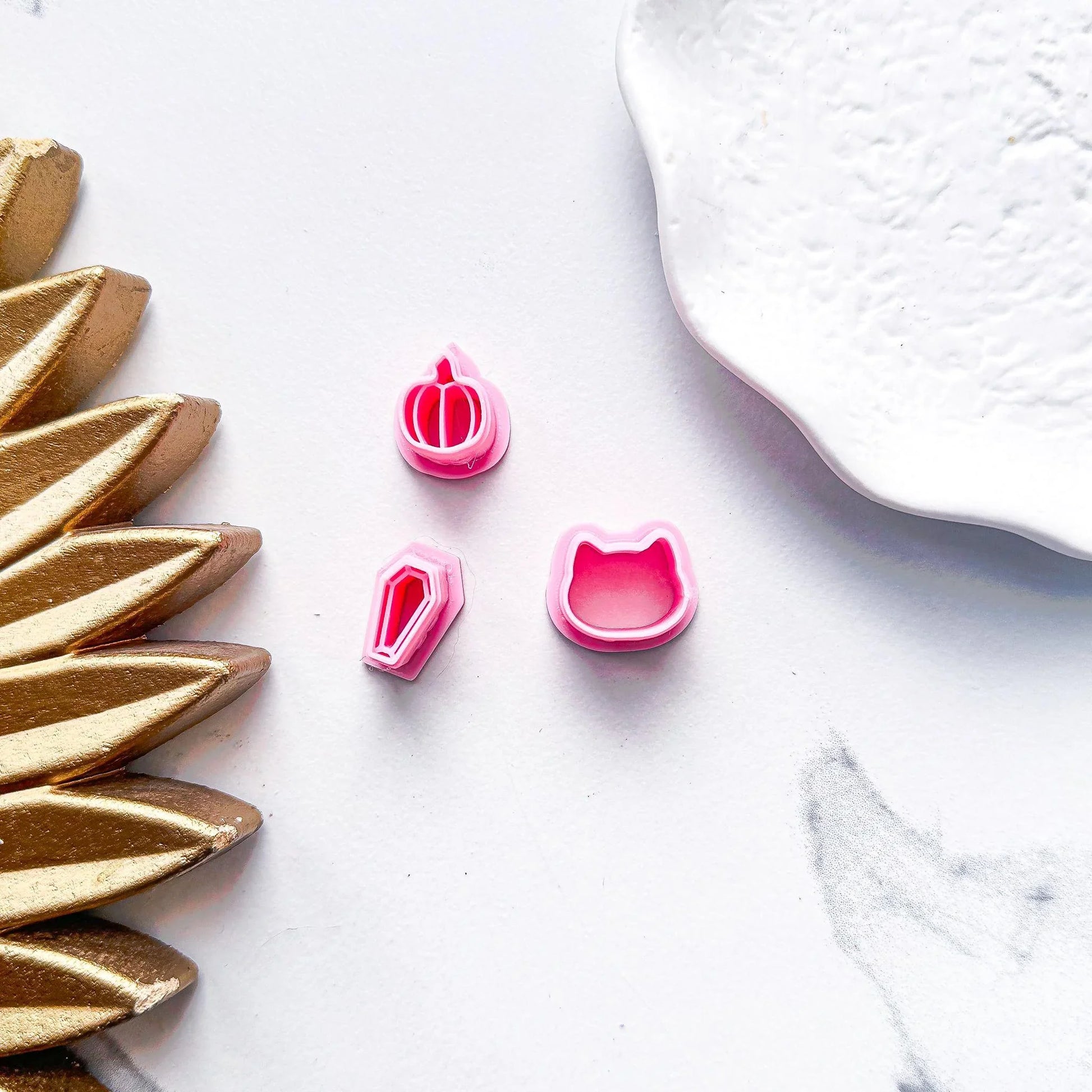 Micro 13mm Halloween Clay Cutter Selection in Pink. pumpkin, cat and coffin cutter shown in bubblegum pink pla material.