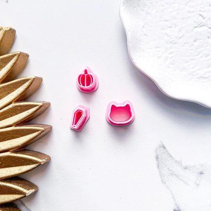 Micro 13mm Halloween Clay Cutter Selection in Pink. pumpkin, cat and coffin cutter shown in bubblegum pink pla material.