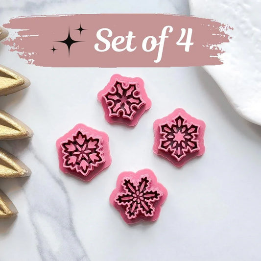 set of 4 snowflake clay cutters in dark matte pink