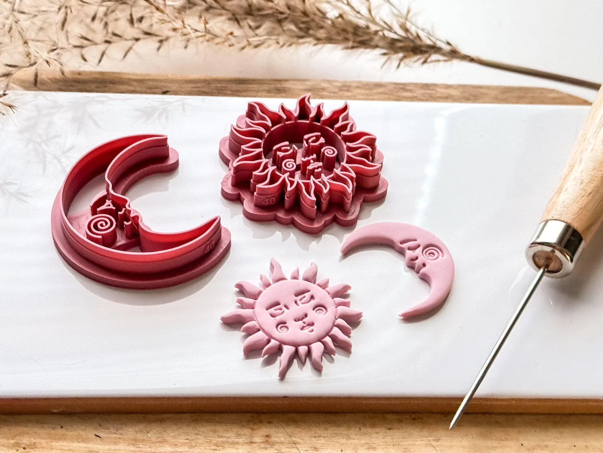 side view of sun and moon clay cutters