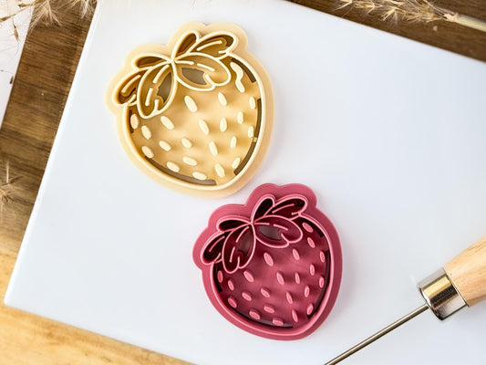 Two strawberry earring cutters for polymer clay, the cutters feature pip and leaf stamp details