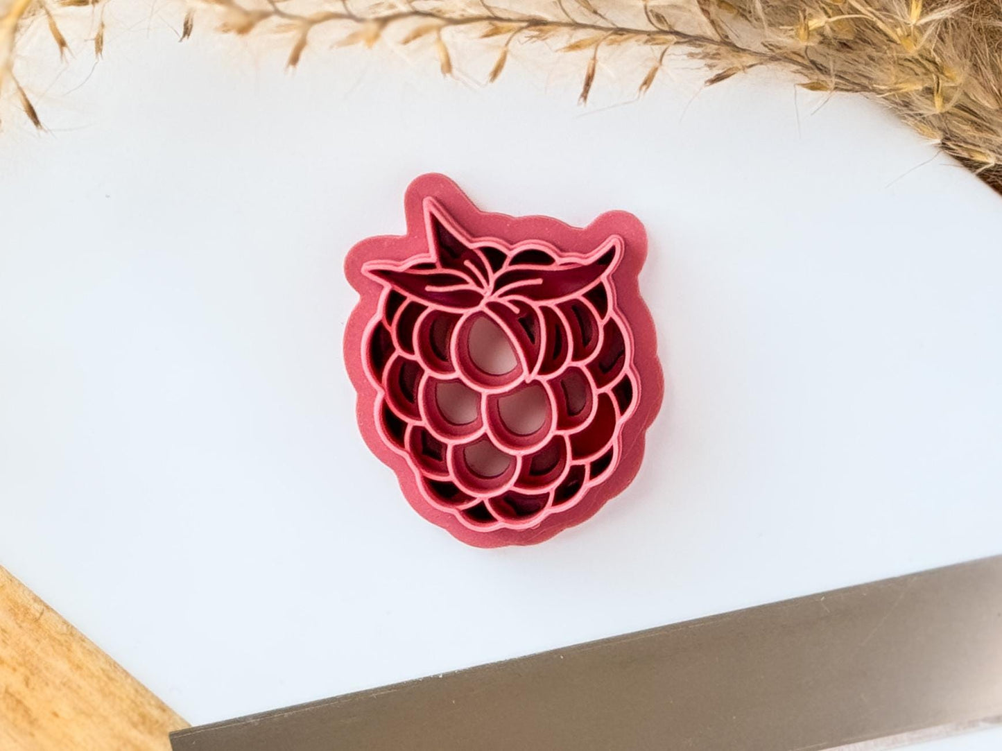 Pink raspberry clay earring cutteron baking tile