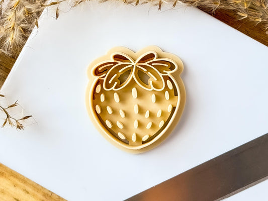 Beige strawberry shaped clay cutter for making polymer clay earrings jewellery and accessories.